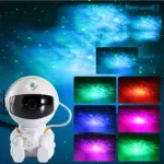 Dekorativni projektor u obliku astronauta osvetljava sobu šarenim zvezdanim nebom za decu i odrasle