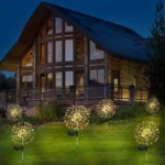 Set od dve solarne lampe drvce koje svetle toplom žutom bojom tokom noći