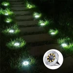 Moderne solarne ubodne disk lampe koje se savršeno uklapaju u svako dvorište i pružaju elegantno belo osvetljenje za staze prilaze i travnjake